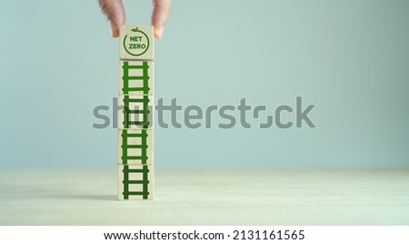 Decarbonization,  low carbon economy for sustainable development. Net zero goal and strategy concept.  rises up Stairs or ladder to goal to net zero icon on white background ,copy space, Goal in 2050 Royalty-Free Stock Photo #2131161565