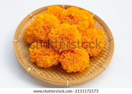 Marigold flowers in bamboo basket