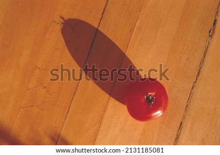 tomatoes placed on the wood and cast a shadow