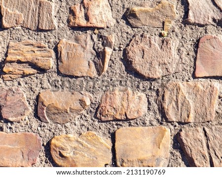 Overhead view of cobblestone street texture. Stone pavement texture