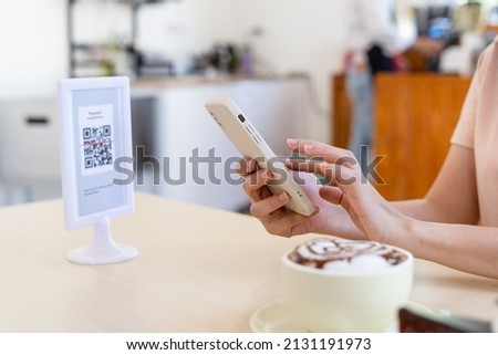 Tourists use phones to scan QR Codes to order food, select menus, pay for food and services. Travel and spend money in new normal