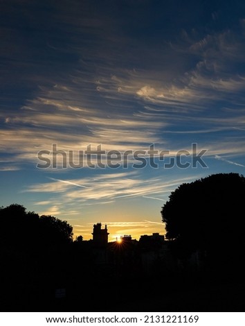 Cirrus clouds and sunset over the skyline of Ramsgate Royalty-Free Stock Photo #2131221169