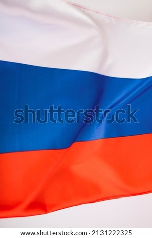 Waving colorful national flag of russia. Russian-Ukrainian conflict concept