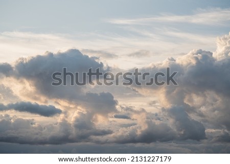 Evening sky with clouds and warm sun light