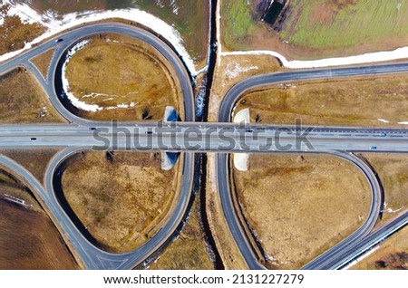 Aerial view of the highway road roundabout. Automobile asphalt circular turn