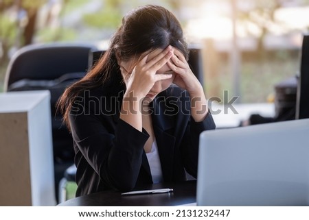 Concept Burnout Syndrome. Business Woman feels uncomfortable working. Which is caused by stress, accumulated from unsuccessful work And less resting body. Consult a specialist psychiatrist. Royalty-Free Stock Photo #2131232447