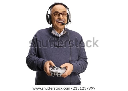 Happy mature man with headphones and joystick isolated on white background