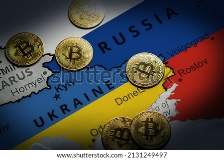 Cryptocurrency standing on the map of Russia and Ukraine. Concept of precaution against financial sanctions Royalty-Free Stock Photo #2131249497