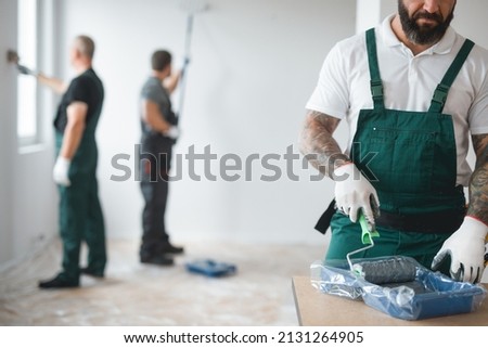 Builder preparing to paint the apartment during renovation Royalty-Free Stock Photo #2131264905