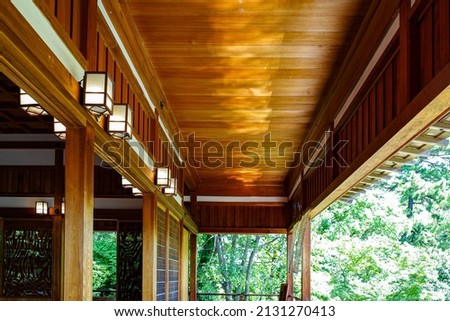 Reflection of the water surface on the wooden ceiling