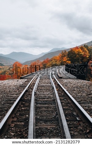 A vertical shot of train tracks in White Mountains in autumn, New Hampshire, USA