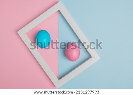 blue and pink easter eggs in a white frame