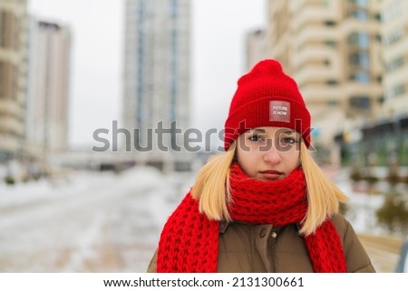 portrait girl teenager red hat winter city.