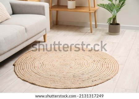 Trendy wicker carpet in stylish living room interior Royalty-Free Stock Photo #2131317249