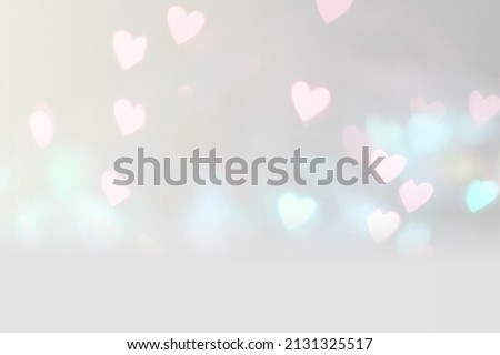 Valentine background with pink heart shaped light bokeh
