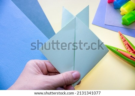 step by step how to make an origami rabbit. easter holiday, greeting card. cute sleeping bunny. Do it yourself concept, activities for kids. instructions for art project for preschool.  rabbit 2023