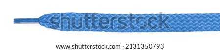Blue  fabric shoelaces isolated on white background. close-up Royalty-Free Stock Photo #2131350793