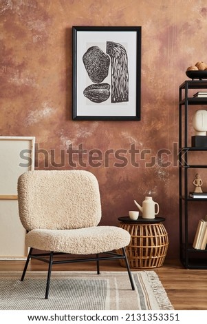 Modern living room interior composition with mock up poster frame, frotte armchair, metal shelf and stylish home accessories. Creative wallpaper. Home staging. Template. Copy space.. Royalty-Free Stock Photo #2131353351