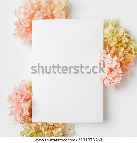 Empty card with pink flowers. Mock up  card on stylish background for presentation or design. Festive and spring concept. Mothers day card or Womens day, Birthday