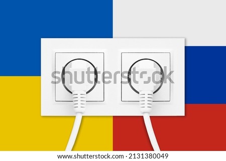 Electrical socket isolated on Russian Federation flag. Sanctions on Russia background. Ukrainian flag backdrop. Electricity price crisis. Stop the war backdrop.