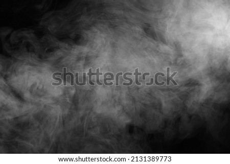 Abstract smoke texture over black. Fog in the darkness. Royalty-Free Stock Photo #2131389773