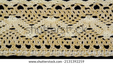 lace fabric. Embroidered fabric set. Close-up, lace decoration with ribbons, embroidered flower braid for design, projects, edging Royalty-Free Stock Photo #2131392259