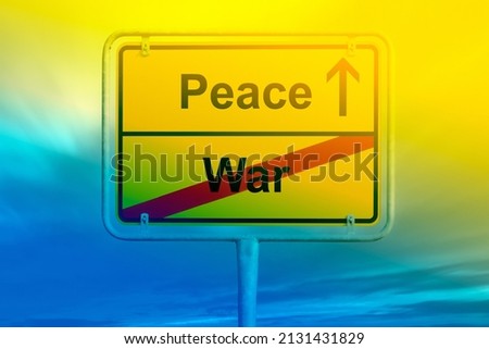 Traffic sign with labels war and peace and clouds in background and Ukraine flag color blue and yellow