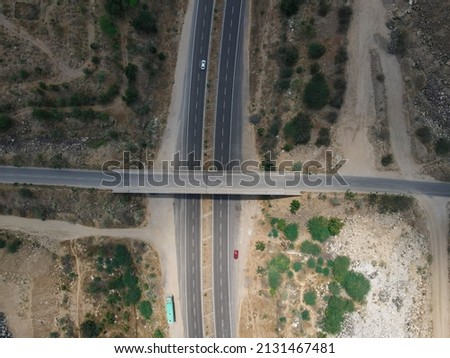 drone shot aerial view top angle bright sunny day beautiful photo national highway road bridge straight pathway wallpaper background green trees bushes 