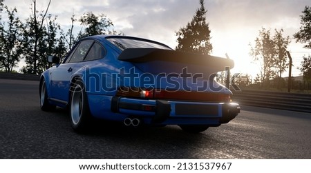 A picture of an old blue german car on the road