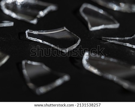 Parts of broken glass on black background, Cracked cup