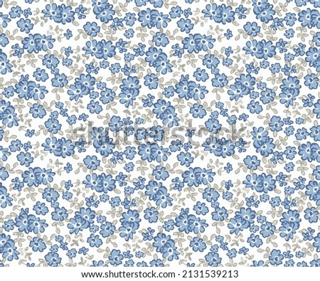 Elegant gentle trendy pattern in small-scale flower. Millefleurs. Liberty style. Floral seamless on blue background for textile, mens wear, cotton fabric, covers, wallpapers, print,