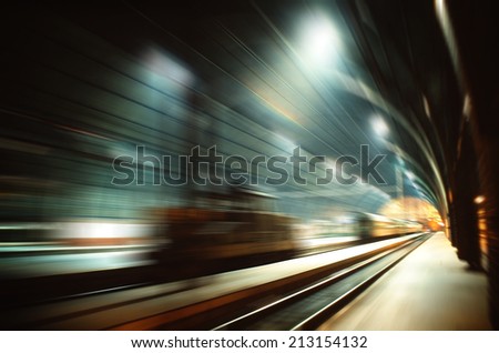 High speed railway travelling - motion blurred image of railway terminal hall Royalty-Free Stock Photo #213154132