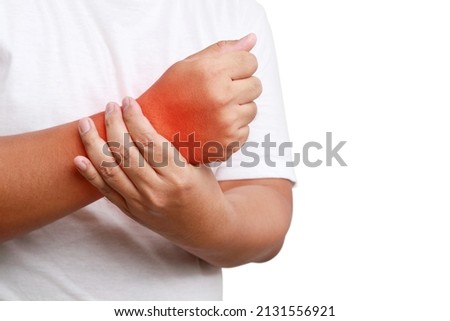 fat man wearing white shirt He has wrist pain, swelling and stiffness. Obesity concept and musculoskeletal disease. Arthritis is caused by joint deterioration, injury, inflammation, or infection.  Royalty-Free Stock Photo #2131556921