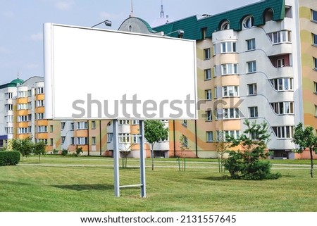 Blank white billboard mockup with gray border. Against the backdrop of city ladies
