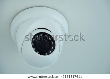 CCTV camera, white CCTV, black lens, for watching movements in the house, office Royalty-Free Stock Photo #2131617411