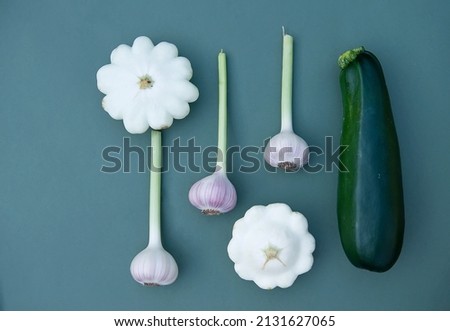 vegetables on a bright background. Healthy food stickers. advertisement of vegetarian lifestyle.garlic and zucchini with pumpkin.Ingredient for a healthy diet. vegetables of different sizes and colors