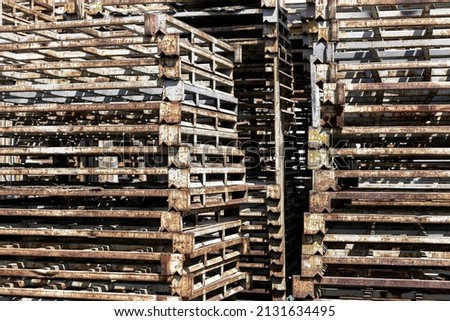 old rusty steel rack on factory in heavy industry background