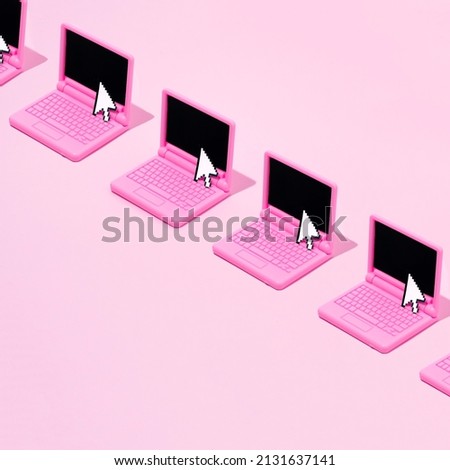 Creative look of a computer template with a pixel arrow on a pastel pink background. Aesthetic idea of retro style of the 80s and 90s. The modern concept of the ancient computer.