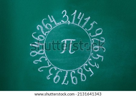 The Greek letter Pi is drawn in chalk on a green school blackboard in a circle of numbers Royalty-Free Stock Photo #2131641343