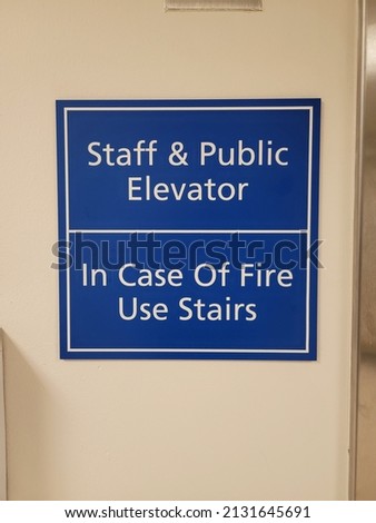 Hospital elevator sign blue and white in English 