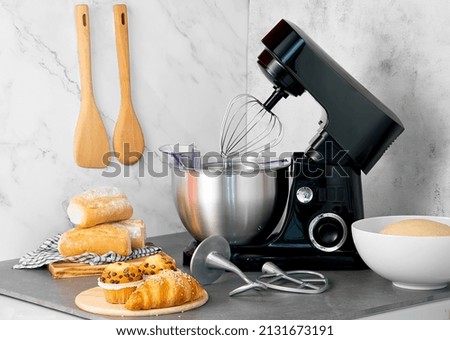 electric kitchen mixer on non-isolated background Royalty-Free Stock Photo #2131673191