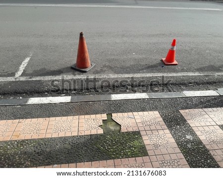 Cone sign, and roadside parking barrier