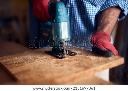 Man assembling furniture and fixing it - hobby concept. Royalty-Free Stock Photo #2131697361