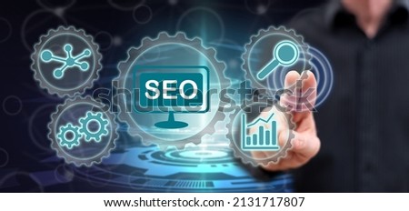 Man touching a seo concept on a touch screen with his fingers