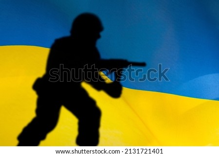 Flag of Ukraine with soldiers shadows. Russian-Ukrainian crisis, conflict, war