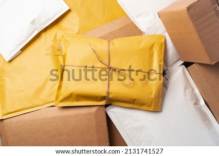 yellow paper postal envelopes. Top view. Royalty-Free Stock Photo #2131741527