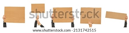 Posters of cardboard in his hands. Isolated on white. Set. Copy space.
