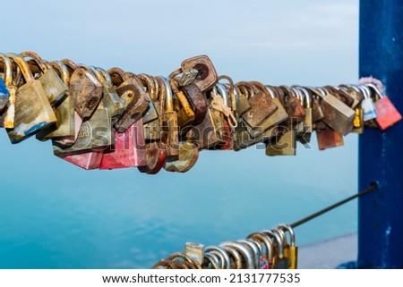 Love padlocks on a banister in Siofok, at the Lake Balaton Royalty-Free Stock Photo #2131777535