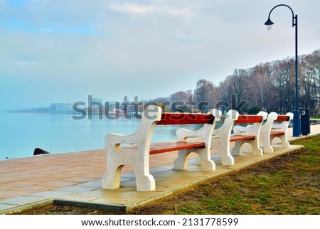 Benches on the beach of the Lake Balaton in Siofok Royalty-Free Stock Photo #2131778599