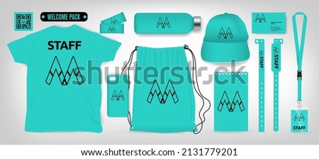 Sample welcome package with corporate gifts.
T-shirt, Bag pack, lanyard, bracelet, cap, card, drink bottle, energy bar, mobile cover, notebook. Vector illustration, editable color  Royalty-Free Stock Photo #2131779201